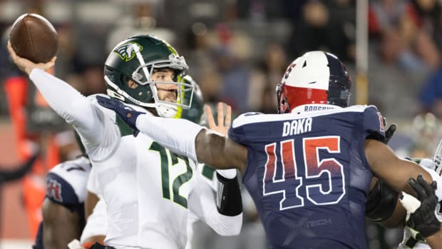 Orlando Guardian quarterback Quinten Dormady attempts a pass during an XFL game.